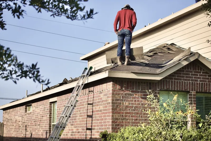 Professional roofer working on a residential roof in Champlin
